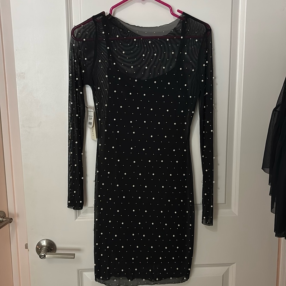 Black dress with stitched pearls and slip